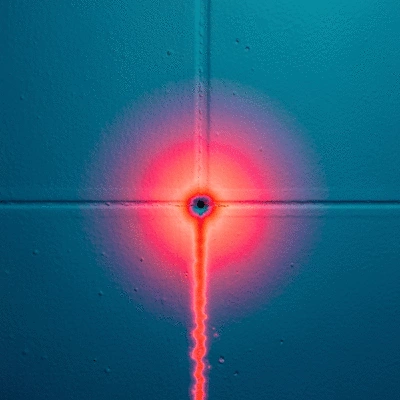 Thermal imaging camera detecting a water leak in a wall, clean image, no text, no words